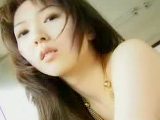 Sexy Asian teen showing off her perky titties