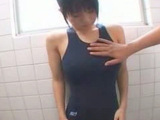 Hot Asian schoolgirl with big tits shows them off